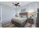 Serene main bedroom with coastal decor, neutral colors, and large windows at 764 S Mccall Rd, Englewood, FL 34223