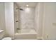 Modern bathroom featuring white marble tile and a rainfall shower head at 3212 Cork Rd, Plant City, FL 33565