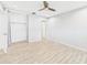 Bright bedroom features tile floors, ceiling fan, and a closet, offering a comfortable living space at 1433 S Belcher Rd # G13, Clearwater, FL 33764