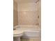 Bathroom featuring a tiled shower-tub combination with modern fixtures and a neutral color scheme at 14663 Norwood Oaks Dr # 103, Tampa, FL 33613