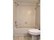 Bathroom featuring a tiled shower-tub combination with modern fixtures at 14663 Norwood Oaks Dr # 103, Tampa, FL 33613