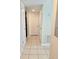 Hallway with tile flooring and access to closets and other rooms within the home at 14663 Norwood Oaks Dr # 103, Tampa, FL 33613