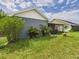 View of the backyard and screened patio area at 1814 Tarah Trace Dr, Brandon, FL 33510