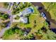 Aerial view of property featuring the house, detached garage, pool, dock, and waterway at 283 Hilltop Cir, Punta Gorda, FL 33982
