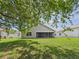 Exterior view of the home from the backyard showing screened patio at 10169 Holly Berry Dr, Weeki Wachee, FL 34613