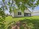 Well maintained backyard with a screened in porch, and lush green grass at 10169 Holly Berry Dr, Weeki Wachee, FL 34613