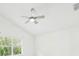 Bright bedroom featuring a ceiling fan, window, and light neutral walls at 10169 Holly Berry Dr, Weeki Wachee, FL 34613