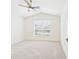 Light and airy bedroom with neutral carpet, ceiling fan, and a window with blinds at 10169 Holly Berry Dr, Weeki Wachee, FL 34613