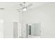 Spacious bedroom featuring a sliding mirror door closet and neutral colored walls at 10169 Holly Berry Dr, Weeki Wachee, FL 34613