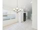 Dining Room with Chandelier next to open kitchen at 10169 Holly Berry Dr, Weeki Wachee, FL 34613
