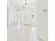 Bright foyer with tile flooring, white trim, and natural light at 10169 Holly Berry Dr, Weeki Wachee, FL 34613