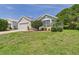Charming single-story home with well-manicured lawn and lush landscaping at 10169 Holly Berry Dr, Weeki Wachee, FL 34613