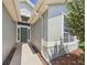 Close-up of the green front door and large window at 10169 Holly Berry Dr, Weeki Wachee, FL 34613