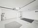 Spacious garage featuring a water heater, storage, and access door at 10169 Holly Berry Dr, Weeki Wachee, FL 34613