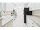 Bright kitchen with stainless steel appliances and white cabinetry at 10169 Holly Berry Dr, Weeki Wachee, FL 34613
