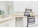 Kitchen area featuring stainless steel appliances and white cabinets at 10169 Holly Berry Dr, Weeki Wachee, FL 34613