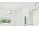 Spacious living room with large windows and modern lighting at 10169 Holly Berry Dr, Weeki Wachee, FL 34613