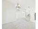 Open living space with carpet flooring and elegant chandelier lighting at 10169 Holly Berry Dr, Weeki Wachee, FL 34613