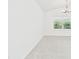 Bright living space with plush carpeting and a large window at 10169 Holly Berry Dr, Weeki Wachee, FL 34613