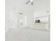 Spacious living room with modern ceiling fan and adjacent kitchen area at 10169 Holly Berry Dr, Weeki Wachee, FL 34613