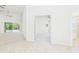 View of back patio from living room with hallway looking into the main bedroom at 10169 Holly Berry Dr, Weeki Wachee, FL 34613