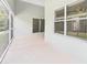 Covered patio features a sliding glass door and backyard access at 10169 Holly Berry Dr, Weeki Wachee, FL 34613