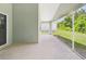 Spacious screened patio with views to the grassy backyard at 10169 Holly Berry Dr, Weeki Wachee, FL 34613