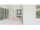 Covered patio has sliding glass doors and backyard access at 10169 Holly Berry Dr, Weeki Wachee, FL 34613