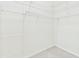 Walk-in closet with metal shelving and carpeted floor at 10169 Holly Berry Dr, Weeki Wachee, FL 34613
