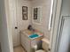 Charming bathroom features shiplap walls, beach decor, and a neutral vanity at 341 Outrigger Pl, North Port, FL 34287