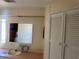Bathroom featuring a large mirror, vanity with storage, and light walls at 341 Outrigger Pl, North Port, FL 34287