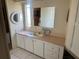 Bathroom with a vanity and sink, mirror, and built in storage at 341 Outrigger Pl, North Port, FL 34287