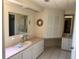Bathroom with a long countertop and sinks on either side at 341 Outrigger Pl, North Port, FL 34287