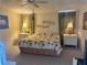 Bright bedroom with natural lighting, tropical bedding, and matching bedside tables at 341 Outrigger Pl, North Port, FL 34287