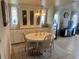 Traditional dining area with built-in cabinets and a round table at 341 Outrigger Pl, North Port, FL 34287