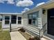 A single-story home with well-maintained lawn and inviting entryway, showcasing the exterior charm at 341 Outrigger Pl, North Port, FL 34287