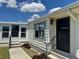 Home featuring a separate entrance and a tidy walkway to the main entry, with neat landscaping at 341 Outrigger Pl, North Port, FL 34287