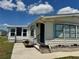 A cozy single-story home featuring manicured landscaping and a bright, sunny atmosphere at 341 Outrigger Pl, North Port, FL 34287