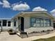 Charming single-story home featuring blue shutters and neat landscaping in a well-maintained community at 341 Outrigger Pl, North Port, FL 34287
