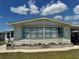 Charming single-story home with well-maintained landscaping and neutral siding at 341 Outrigger Pl, North Port, FL 34287