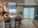 Kitchen with a center island, granite countertops, stainless steel appliances, and a window for natural light at 341 Outrigger Pl, North Port, FL 34287