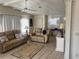 The living room features great seating and a neutral color scheme at 341 Outrigger Pl, North Port, FL 34287