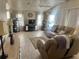 The living room features great seating and a neutral color scheme at 341 Outrigger Pl, North Port, FL 34287