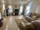 The living room features great seating and a neutral color scheme at 341 Outrigger Pl, North Port, FL 34287