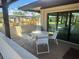 Outdoor patio with seating area overlooking the bocce ball court at 341 Outrigger Pl, North Port, FL 34287