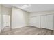 Bright bedroom with wood flooring, white walls, a skylight and spacious closets at 1103 W Dixie St, Plant City, FL 33563