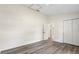 Spacious bedroom with wood flooring, an entrance, a large closet, and white trim at 1103 W Dixie St, Plant City, FL 33563
