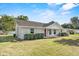 Well-maintained home with a lush green lawn, complemented by mature landscaping at 1103 W Dixie St, Plant City, FL 33563