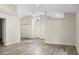 Bright, open-concept living room with neutral walls and durable wood-look flooring at 1103 W Dixie St, Plant City, FL 33563