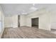 Inviting living room featuring wood-look flooring, neutral walls, and ample space at 1103 W Dixie St, Plant City, FL 33563